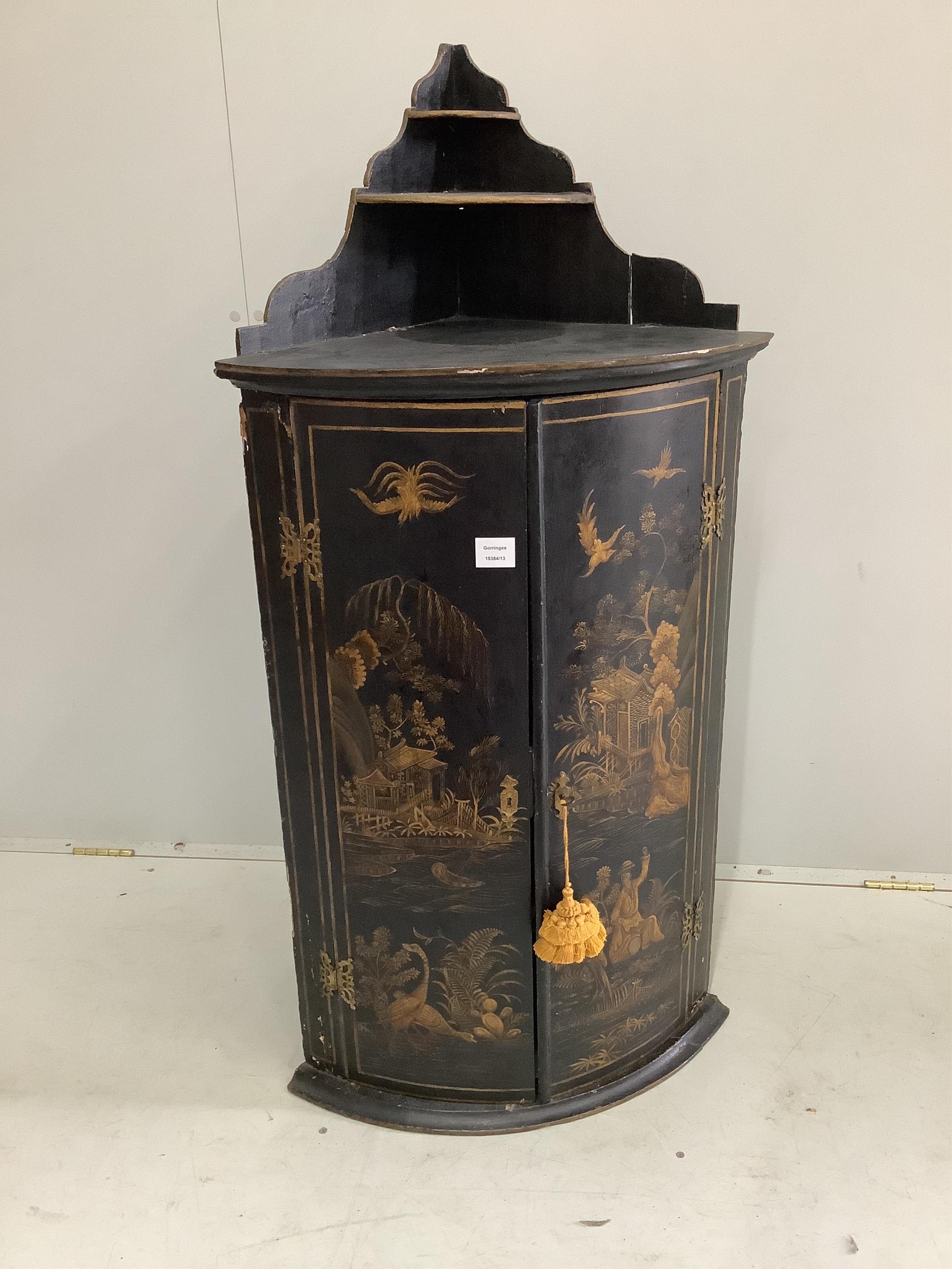 An 18th century chinoiserie lacquer bowfront hanging corner cupboard, width 59cm, depth 40cm, height 123cm. Condition - fair